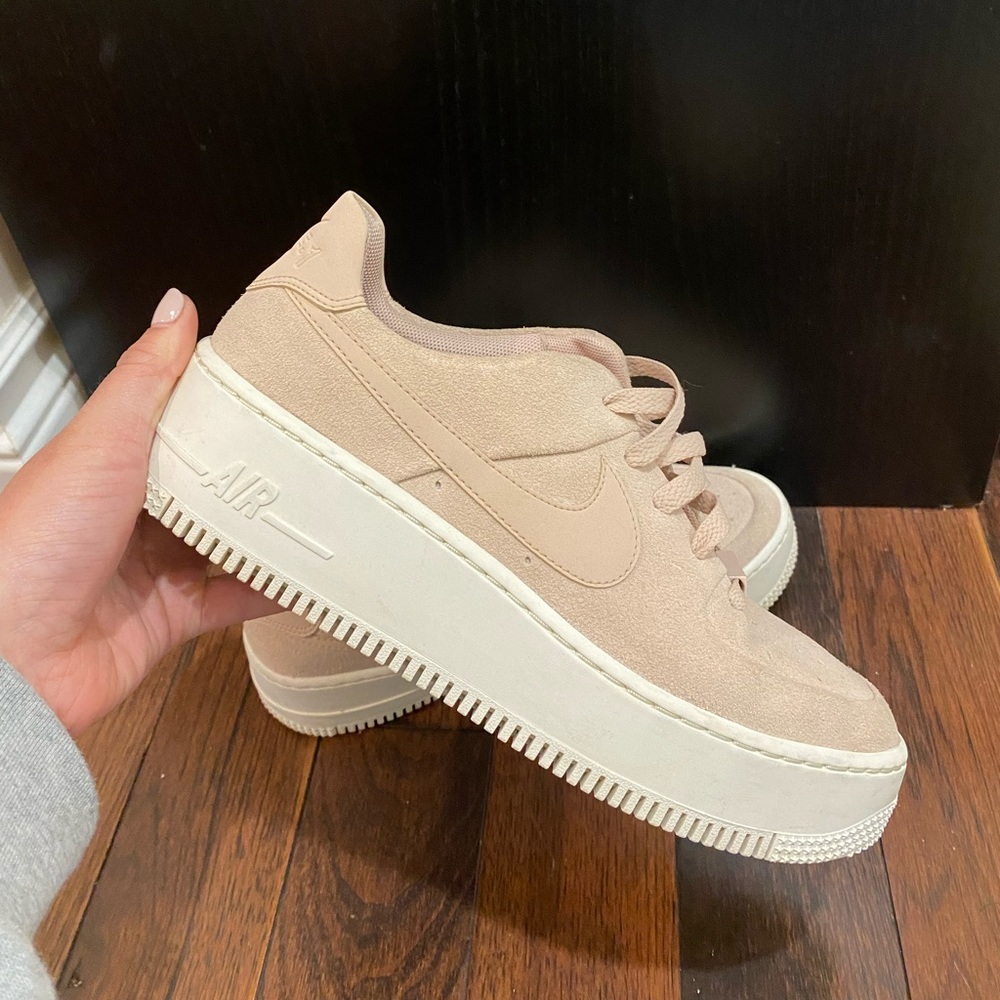 Pink suede Nike airforce 1 platforms.